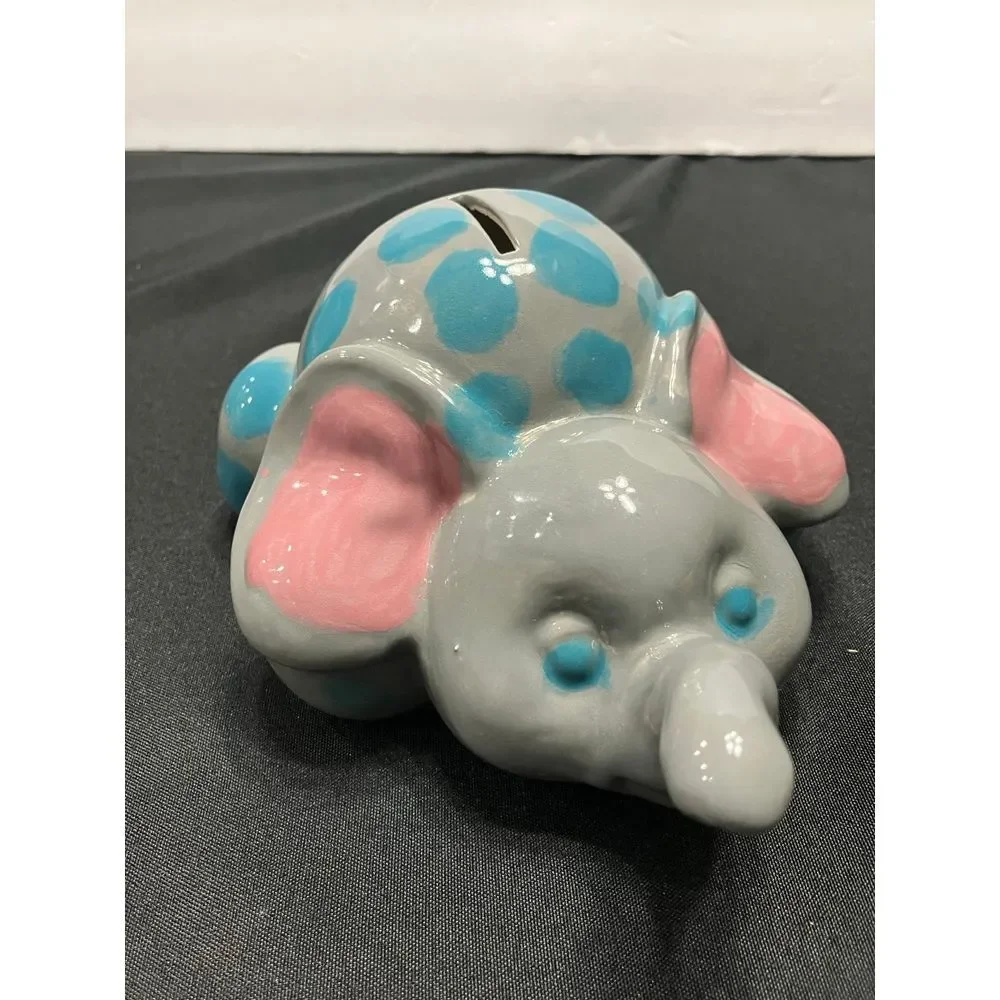 Vintage Elephant piggy bank. Gray with blue dots‎
